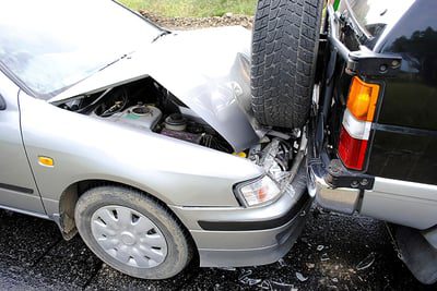 Personal injury attorneys at Murphy & Prachthauser discussing car accident settlement cases during a client meeting.